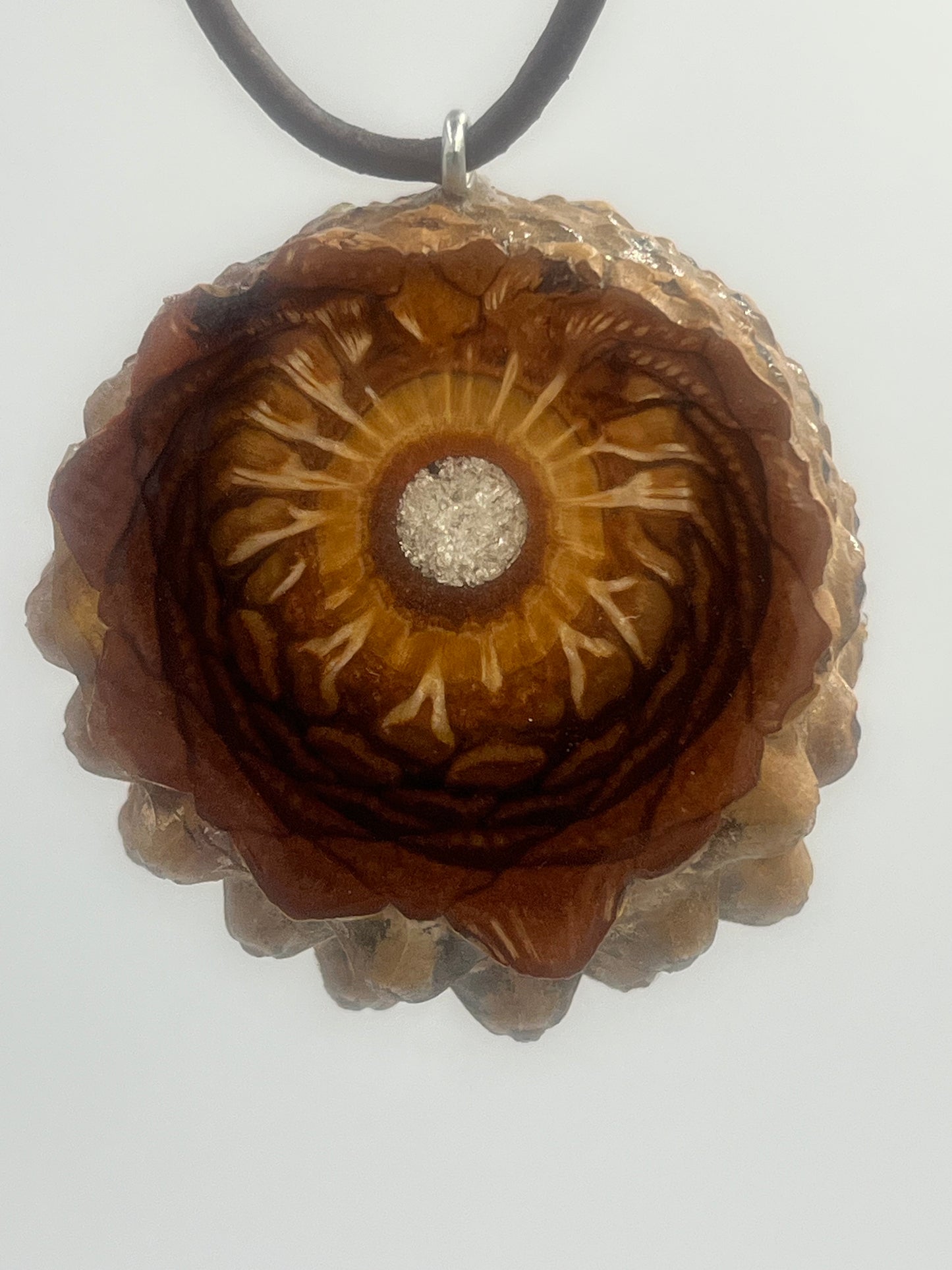 Knobcone pinecone pendant with silver leaf inlay